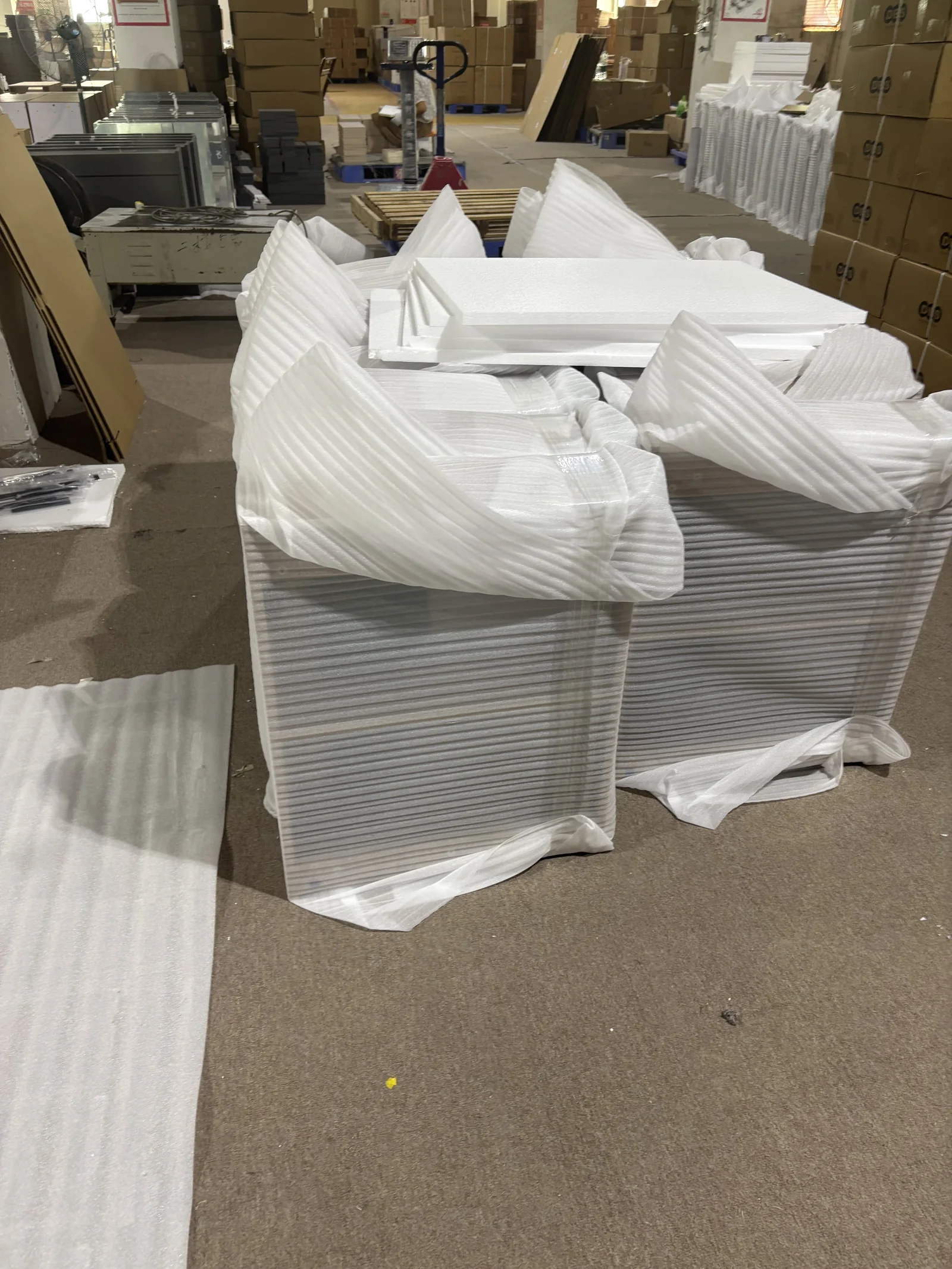 Protected bathroom vanity units prepared for packaging